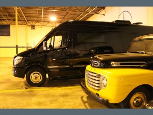 nice van and nice old truck in garage